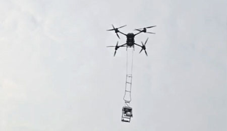 Using a drone to carry and attach to the wire
